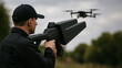 © AiDesign - Anti drone gun operator aiming at flying drone in outdoor environment for security surveillance defense and airspace protection