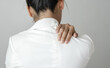 © Orathai - Woman having shoulder pain pain during work long time. stretching to relax and relax while working hard at the office