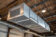 © Rashida - Industrial Metal Ductwork Suspended from Exposed Wooden Beams in a Modern Loft Space
