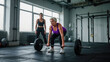 © Ed - Training with free weights, an elderly woman doing exercises with barbell under supervision of personal trainer in modern fitness center, concept of training in old age and maintaining muscle tone