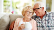 © Concept Island - Lovely happy senior couple enjoying a cup of tea at home. Elderly married man and woman enjoying the good moments in life
