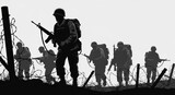 Silhouetted soldiers walking between barbed wire fences
