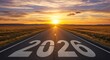 © Cleverson - Horizon road stretching into the sunset with '2026' marked as a journey towards the future in the open plains