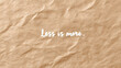 © Oksana_Latysheva - Minimalist brown crumpled paper background with the phrase “Less is more.” Ideal for branding, simplicity themes, or lifestyle and design concepts.