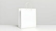 © Fizzah - Blank paper shopping bag with handles on white background