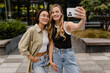 © mary_markevich - two young pretty women students in street