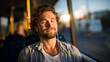 © Maksym - Young man with headphones smiles softly, eyes closed, as golden hour sunlight streams warmly through bus window, casting a gentle glow on his relaxed face during peaceful travel mo
