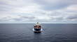 © wiplens - Large container ship sails ocean global trade transport