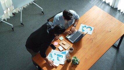 Wall Mural - skilled project manager walking at table while colleague brainstorm idea. business team working toge