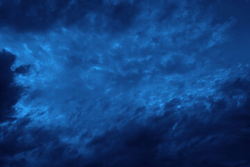 Wall Mural - Black dark blue sky with clouds. Night sky abstract background. Dramatic cloudy wind rain storm. Design.