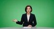 © Dmitry - Woman news anchor on green screen. Female newscaster gesturing during broadcast. Studio report chroma key backdrop for media production.
