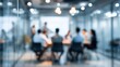 © Harry - Blurred corporate meeting with colleagues brainstorming ideas inside glass conference room with modern lighting, a professional workspace.