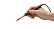 © Donnangelo - A hand holding a soldering iron with a black handle against a black and white background space area