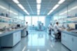 © Romi - Blurred image of scientists working in a modern laboratory setting. Blurred background for use.