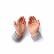 © Wall Art Galerie - A pair of small child’s hands with palms open and facing upward, wearing gray knitted sleeves, isolated on a white background.