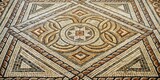 Ancient Roman mosaic floor with intricate stone patterns