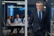 © Rony - Confident Middle-Aged Businessman Standing at Office Entrance – Leadership and Corporate Meeting Concept