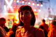© zhukovvvlad - Young woman dancing at concert, having fun at night on open air stage. Sexy woman enjoying music at concert. Cheerful girl hanging out at dance party.