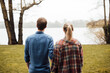 © Westend61 - Man and woman looking at lake