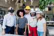 © Westend61 - Smiling business colleagues wearing different glasses and helmets in office