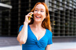 © Westend61 - Smiling woman talking on smart phone in city