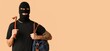 © Pixel-Shot - Male thief with crowbar and bag on beige background with space for text