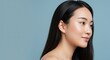 © Anastasiya - Asian woman with long hair looking thoughtfully to the side