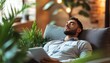 © santima - Man relaxing among indoor plants at home.