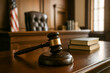 © thodonal - Gavel and law books in an elegant courtroom setting