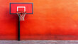 © Orawan - Old basketball hoop on rusty orange wall, abandoned outdoor court, nostalgic urban scene