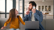© Yuliia - Noisy Caucasian girl kid schoolgirl need attention bad behavior mischievous little child laugh male parent man speaking mobile phone dad guy work laptop freelance father ignore daughter at home family