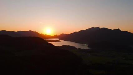 Sticker - Sunset Over a Valley with a Lake and Mountain Silhouettes