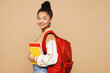 © ViDi Studio - Side profile view young smiling teen girl student wear casual clothes backpack bag hold books look aside on area isolated on plain pastel light beige background High school university college concept