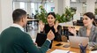 © Habiba - Business team engaged in collaborative meeting in modern office