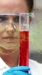 Wall Mural - Animation of dna helix over close up of caucasian woman shaking liquid filled test-tube