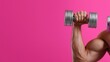 © OleksandrZastrozhnov - Muscular arm lifting dumbbell against pink background