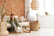 © Pixel-Shot - Young pretty woman resting on floor near sofa in beautiful living room