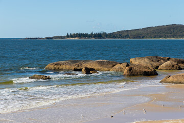 Wall Mural - Rocky coastline view during the sunny day.