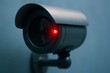 © AntariCode - A futuristic surveillance camera with a glowing red light monitors in a minimalist studio shot.