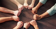 © peopleimages.com - People, hands or circle with fist for team building, unity or mission together above. Top view, group or community with solidarity, trust or support for social inclusion, connection or cohesion