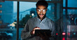 © peopleimages.com - Tablet, research and businessman in office at night analyzing stock market by window for trading. Digital technology, professional and male financial analyst with online finance report for investment
