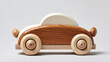 © Станислав Пархоменко - A photo of a wooden toy car on a clean white background