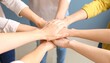 © MSF - A group of people join hands in a symbol of teamwork and unity