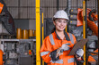 © Quality Stock Arts - Smart engineer Asian women robot technician worker happy smiling in modern factory industry