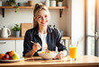© Jira switch - Young woman enjoying breakfast and orange juice at home, healthy.