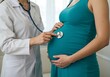 © Rafie - Pregnant woman holding stethoscope on her belly for baby health check