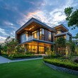 © e_zeynall1 - A modern architectural marvel is bathed in the soft glow of dusk, the elegant lines of a contemporary home showcased amidst meticulously landscaped greenery, creating a serene ambiance.
