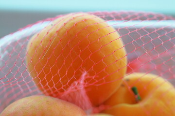 apricots, fruit, mesh bag, close-up, macro, ripe, orange, summer, fresh, healthy, texture, natural, sweet, organic, vibrant, selective focus, juicy, snack, background, food