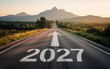 © Sema - New year 2027 written on the road in the middle of asphalt road at sunset. Concept of planning , challenge,