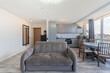 © Mindaugas Dulinskas - Modern Home Open Living Room With Sofas and Large Windows Overlooking City Scene